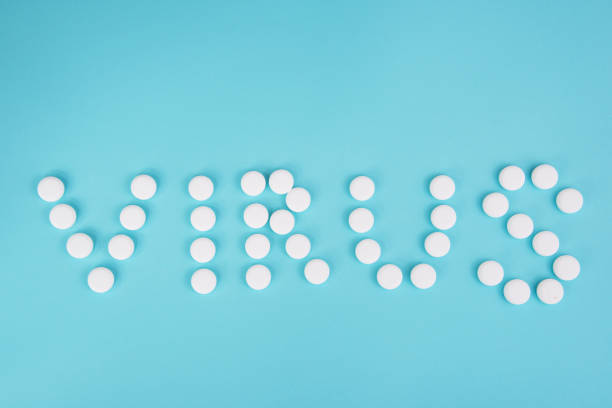 istock White pills in form word coronavirus on blue background 1341731053