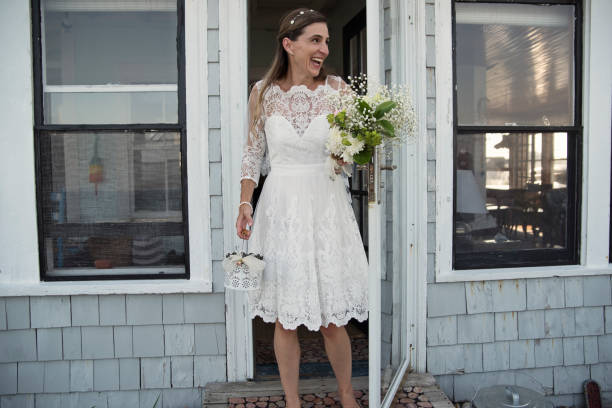 Woman in her 20s, dressed in period costume, looks zany and crazed.