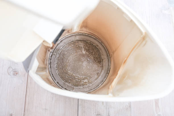 istock Limescale, lime scale in old kettle in kitchen. A white, chalky residue of calcium carbonate. Household appliances repair caused by hard water 1341743664
