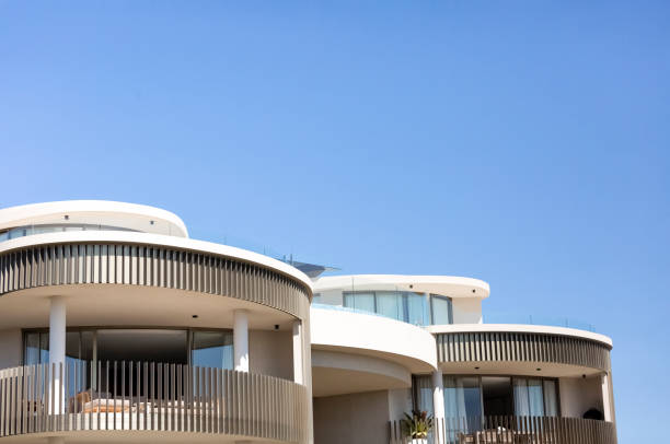 istock Closeup new, modern apartment building, sky background with copy space 1341746291