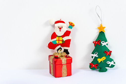 Christmas ornament Santa Claus and a Christmas tree on a white background