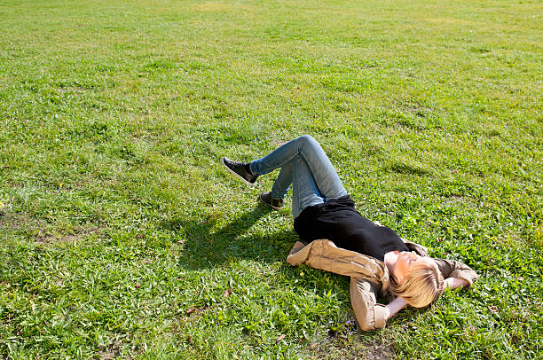 istock young woman lying on a meadow 134174898