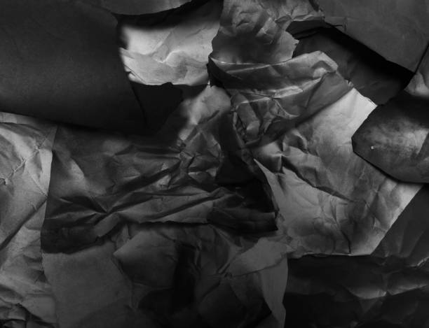istock crumpled black and white paper, background 1341750245