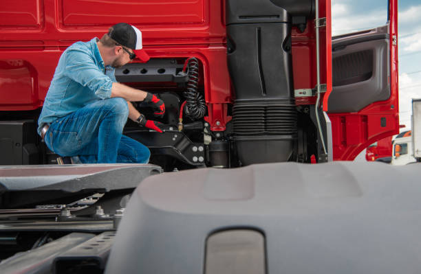 istock Professional Truck Driver Checking Systems in His Semi Truck 1341751292