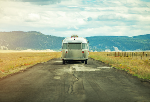 Summer Journey Across America in the Travel Trailer. Classic Recreational Vehicle Crossing Colorado Prairies. RVing Theme.
