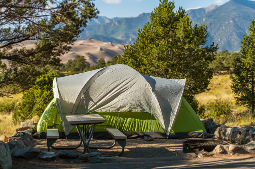 Scenic View Campground Pitch with Large Green Tent. Camping in Great Sand Dunes National Park Colorado, United States of America.