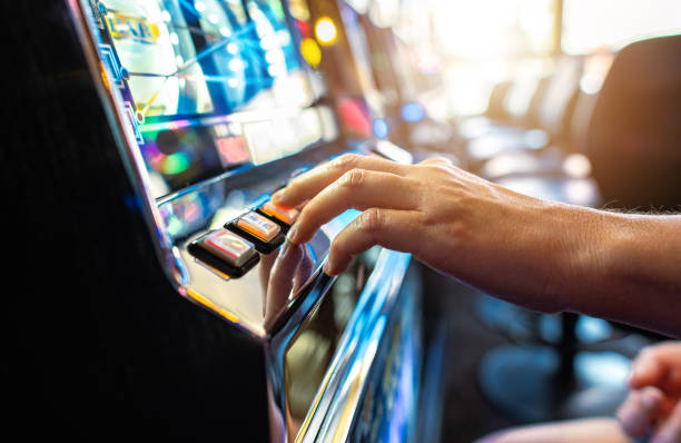 istock Woman Playing Classic Slot Machine 1341752469