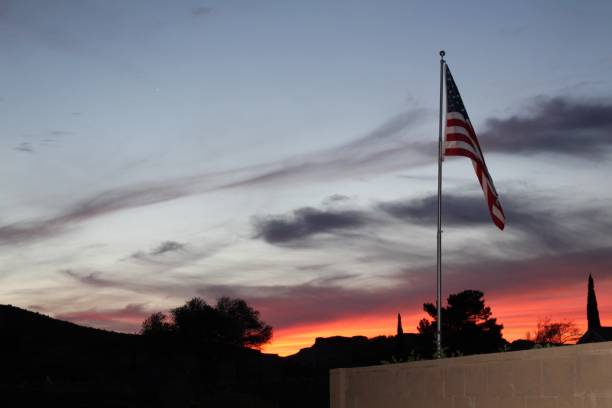 istock American flag at dusk 1341754744