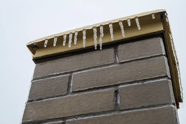 istock Brick pillar covered with ice and icicles after freezing rain 1341755372
