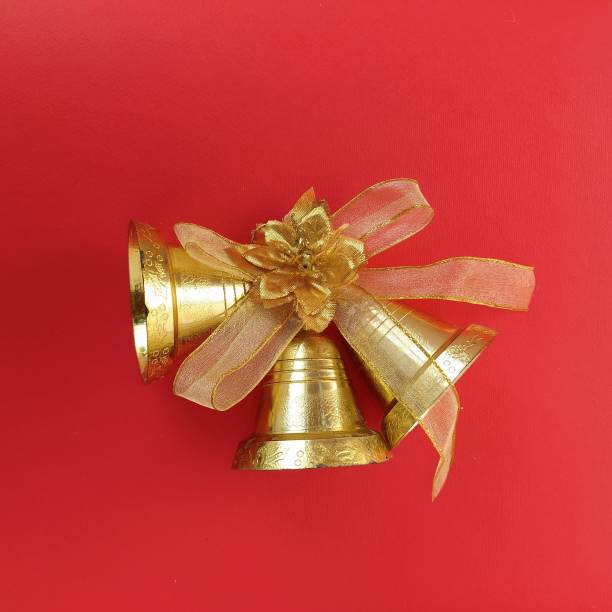 istock Christmas decorations. Gold bells with ribbon on red background 1341761964