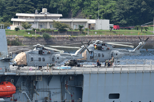 Kanagawa, Japan - August 21, 2021:Royal Navy AgustaWestland AW101 Merlin HC4 utility helicopter on the RFA Fort Victoria (A387) replenishment oiler.