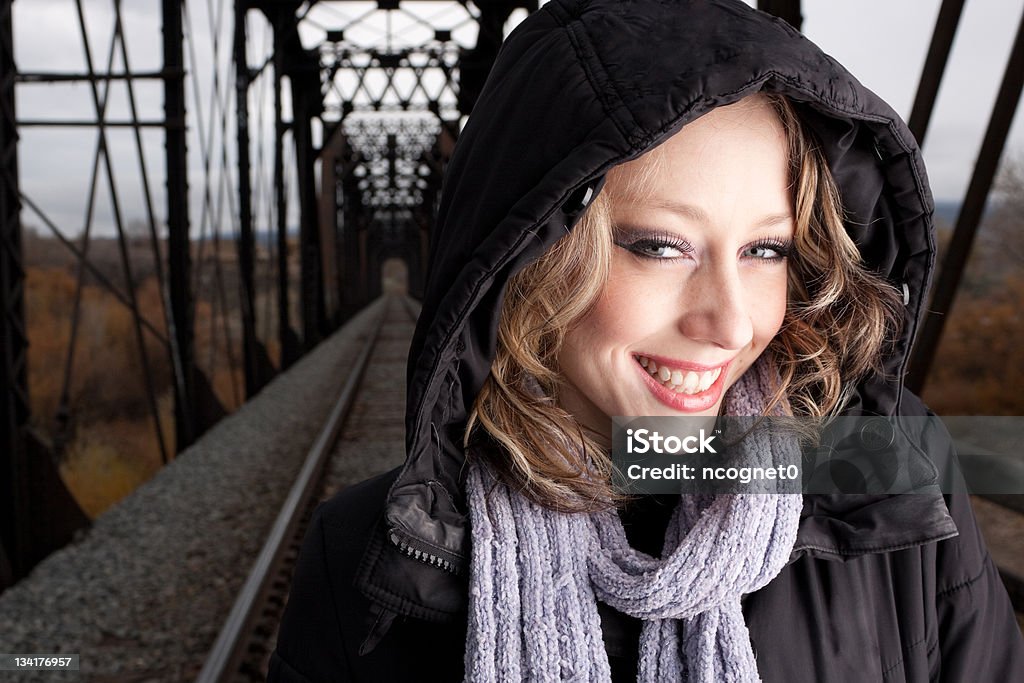 Beautiful young woman on railroad tracks Pretty woman on old railroad bridge 20-29 Years Stock Photo