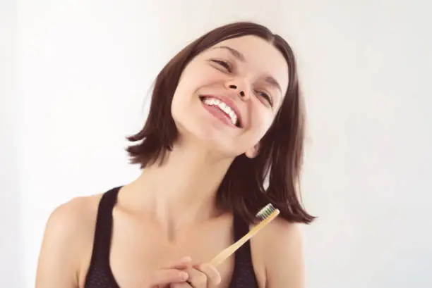 Photo of Young girl is cleaning her teeth.