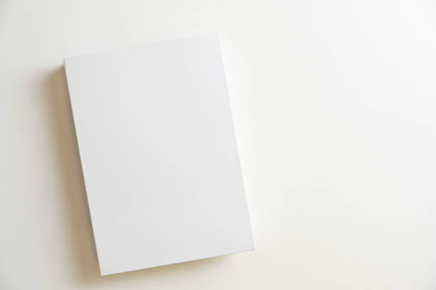 istock White blank book cover for montage on white background. Top view 1341781293