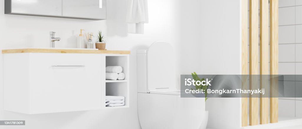 Stylish bathroom interior in bright white decoration style Stylish bathroom interior with minimalist cabinet with sink, mirror, toilet bowl, towels in bright white decoration style. 3d rendering, 3d illustration Toilet Stock Photo