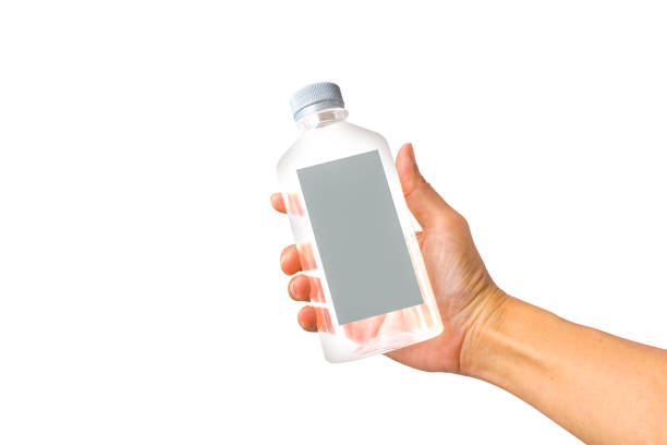 Hand holding an empty label plastic water square water bottle, fruit juice isolated on white background - Clipping path stock photo