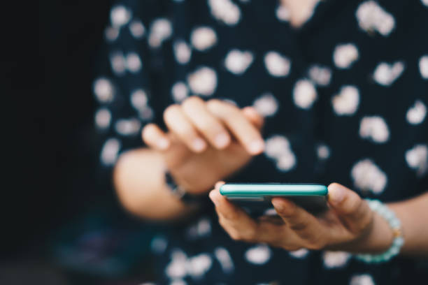 istock Woman hand using smartphone to do work business, social network, communication concept. 1341784954