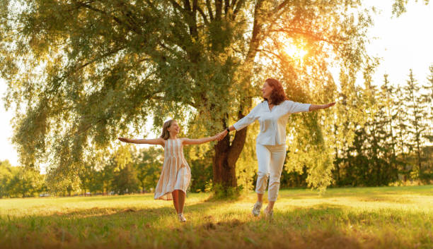 istock Happy family at sunset 1341787420