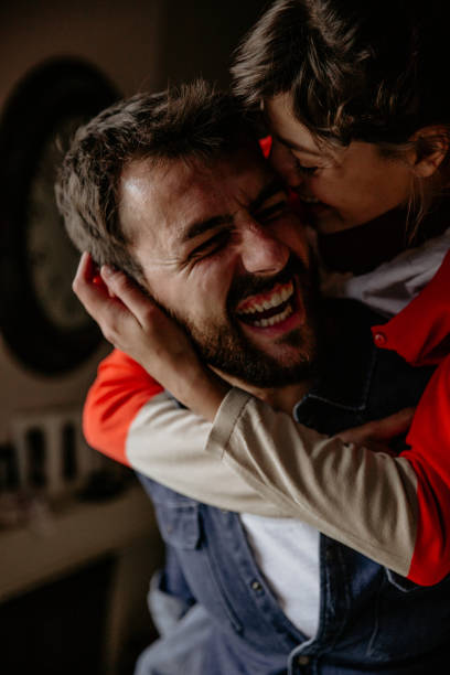 istock Man and woman laughing laugh while having a piggyback ride 1341789401