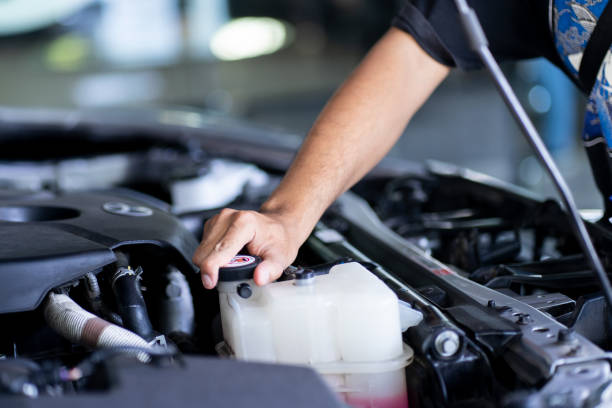 Human Hand Checking Coolant Liquid Mechanic Hand checking the coolant water or liquid coolant stock pictures, royalty-free photos & images