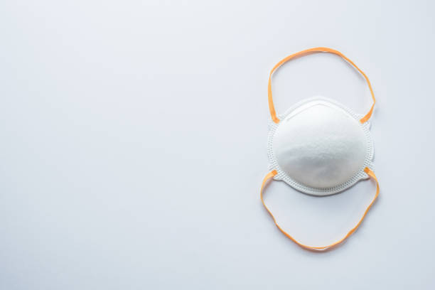 istock White R95 Face Mask on White Background 1341796243