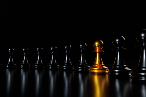 istock Unique gold pawn. Standing out from the crowd concept. 1341797423