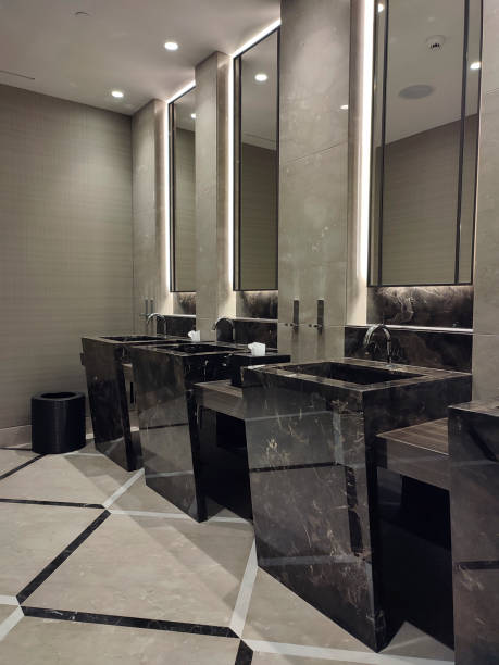 istock Public restroom with sinks and mirrors. 1341799000