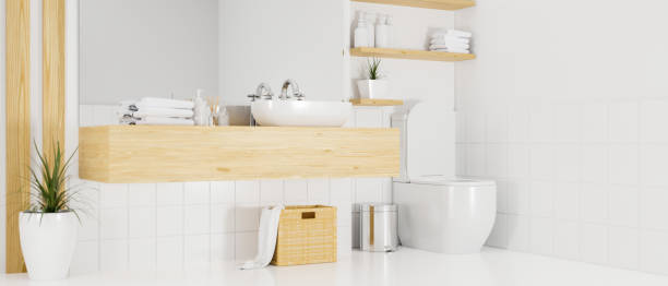 大きな鏡と洗面器カウンター、白い壁と床の便器付きミニマリストスカンジナビアのインテリアのバスルーム - hotel clean home interior bathroom ストックフォトと画像