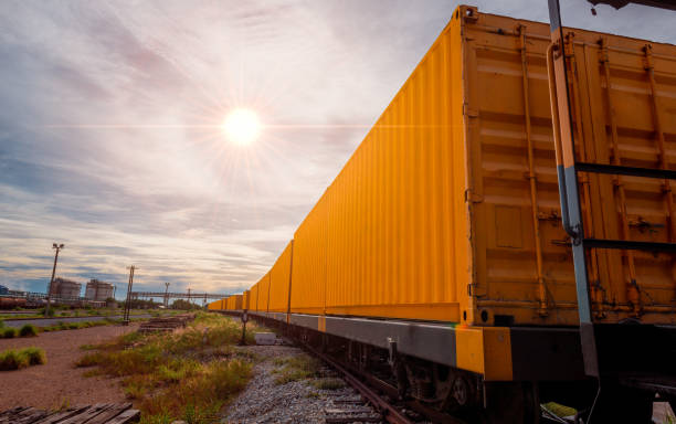 istock Train with container cargo boxes at railway station transport logistic distribution goods is industry business concept. 1341806650