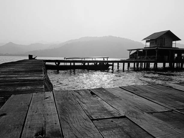 istock wooden house on the water 1341807975