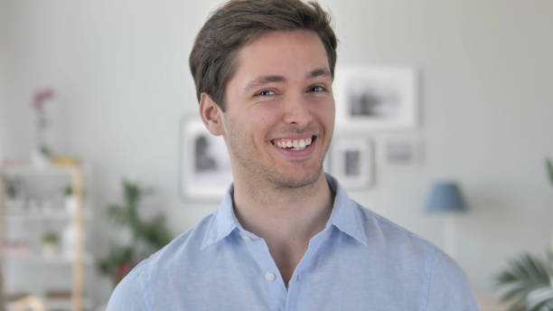istock Yes, Positive Handsome Young Man Accepting Offer by Shaking Head 1341808029