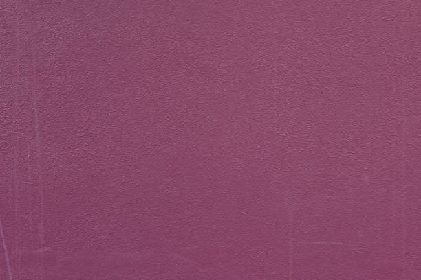 A close-up view of a textured purple wall surface showcasing intricate patterns and a vibrant tone. Ideal for background, design, or art projects.