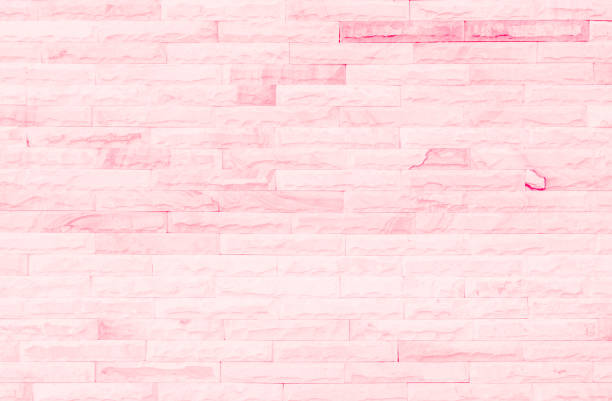 Empty Pink brick wall texture background in the bedroom at lovely. Brickwork stonework interior, rock old clean concrete grid uneven abstract weathered brick design, horizontal architecture wallpaper.