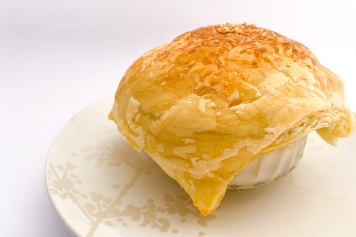 Zuppa soup is a bowl of Thick milky chicken and vegetables soup covered by crispy pastry