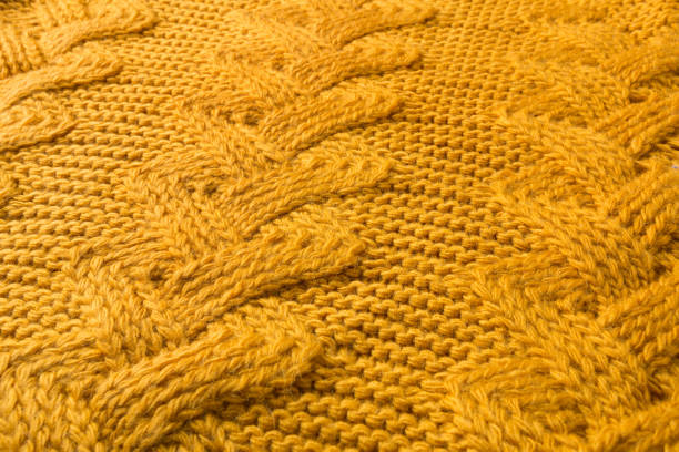istock yellow knit fabric with large patterns, diagonal arrangement 1341809204