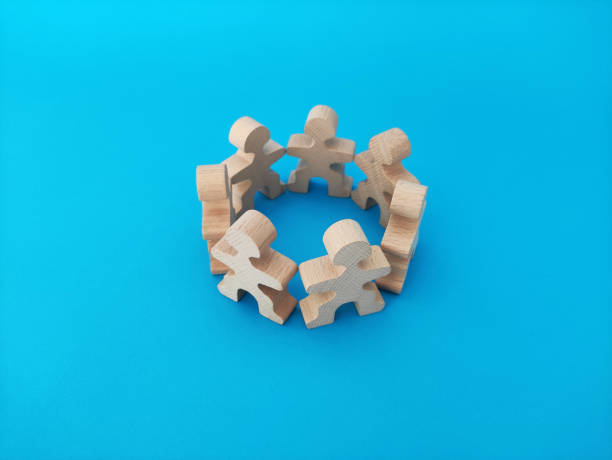 istock Teamwork and cooperation concept, people stand in a circle on a blue background 1341811430