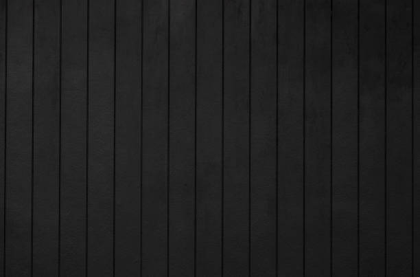 istock black wooden wall background and texture. dark vertical timber panel. 1341811744