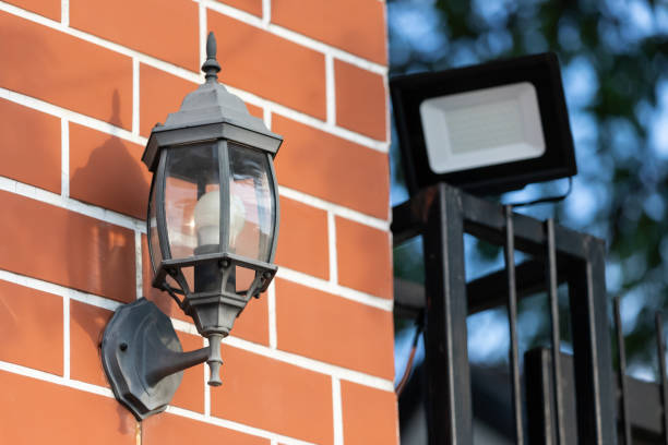istock black vintage lamp on red brick wall. 1341811768