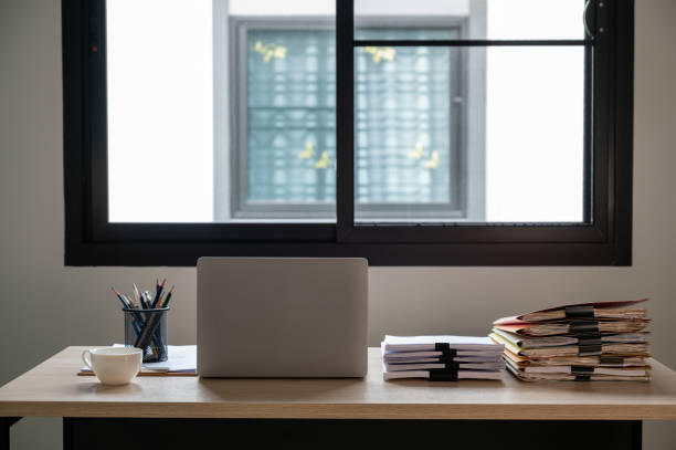 istock Stack of documents with paper clip folder placed on a business desk in a business office. 1341817968