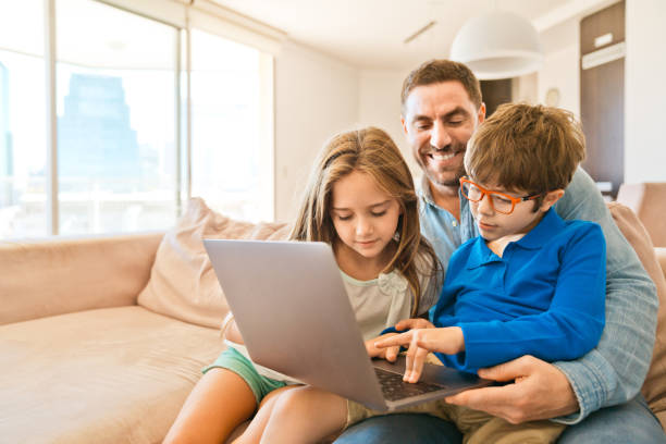 istock Family watching laptop together 1341820527