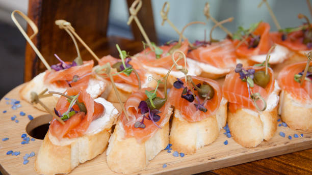 istock small sandwiches with soft cheese and salmon on wood table 1341821824