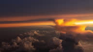 istock Flying along Thunderstorms during sunset(Cockpit POV Shot) 1341823262