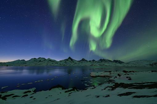 Aurora borealis over the Tasiilaq Fjord (Danish: Kong Oscars Havn). It is located in East Greenland.
