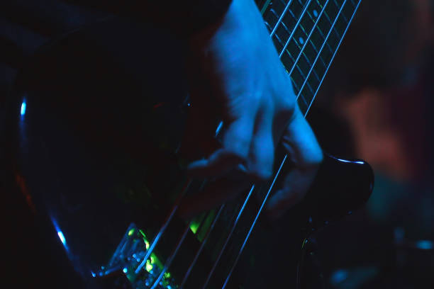 istock The bass player plays a five-string bass guitar 1341823702