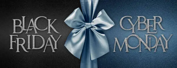 Photo of black friday cyber monday gift card with shiny blue ribbon bow isolated on glittering black background template with written text, horizontal banner of advertising label promotional discounts offer