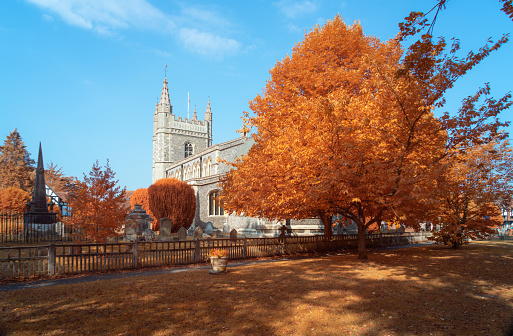 Early Autumn at the Church of St Mary and All Saints in Beaconsfield, Buckinghamshire. Image shot on a camera converted to shoot in full-spectrum infrared, giving the scene a very autumnal feel.
