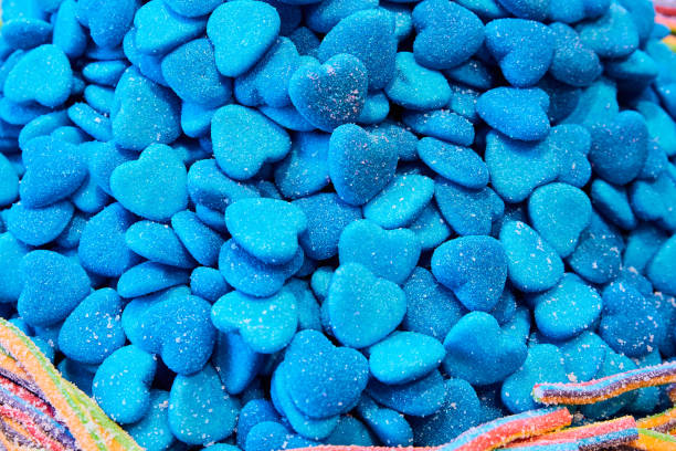 istock Blue Heart shaped gummy candy. Close-up, selective focus 1341826552