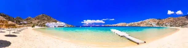 Photo of Greek summer holidays. Best beaches of Ios island - Mylopotas with crystal clear waters. Creece, Cyclades