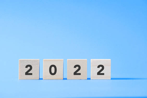 istock New Year concept with 2022 text on wood cube shape, New Beginning. copy space 1341829619