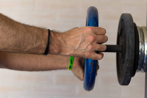 weights and fitness training equipment weights and fitness training equipment on the gym floor griff stock pictures, royalty-free photos & images